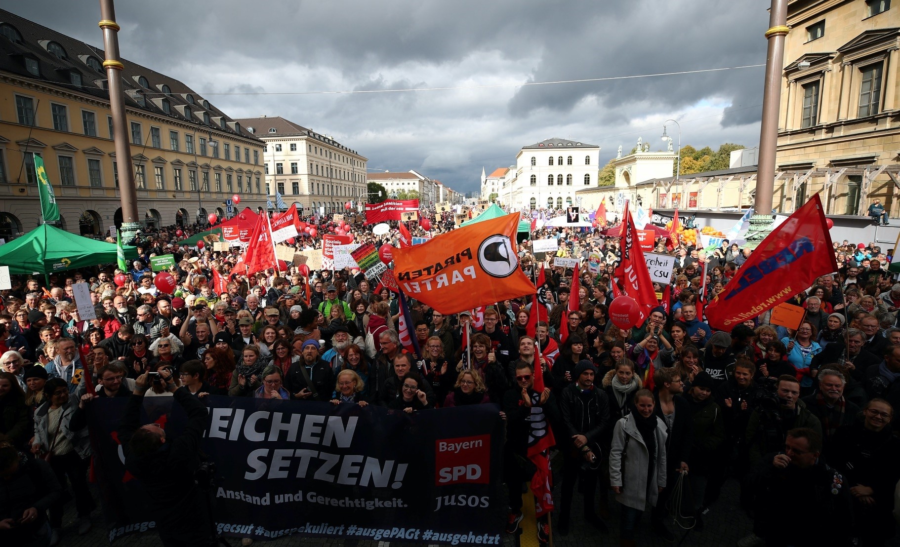 People gather to protest against populism, the trend increasingly associated with the political right and the use of hate speech, during a demonstration in Munich, Germany, Oct. 3.