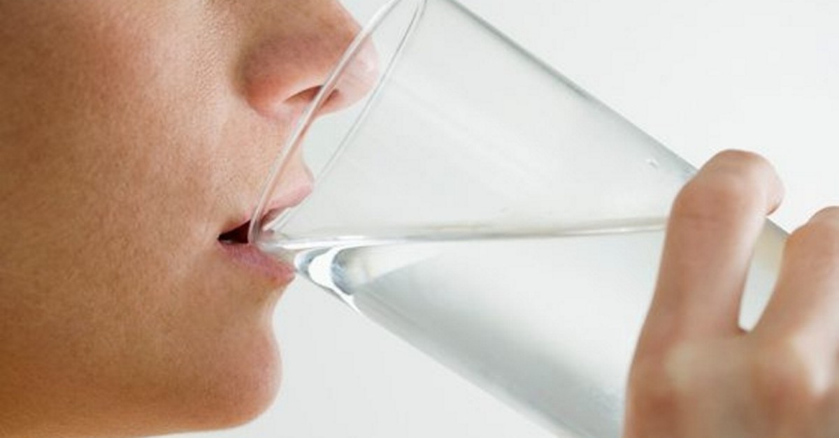 Woman drinking glass of water (FILE Photo/Royalty-Free/Corbis) 