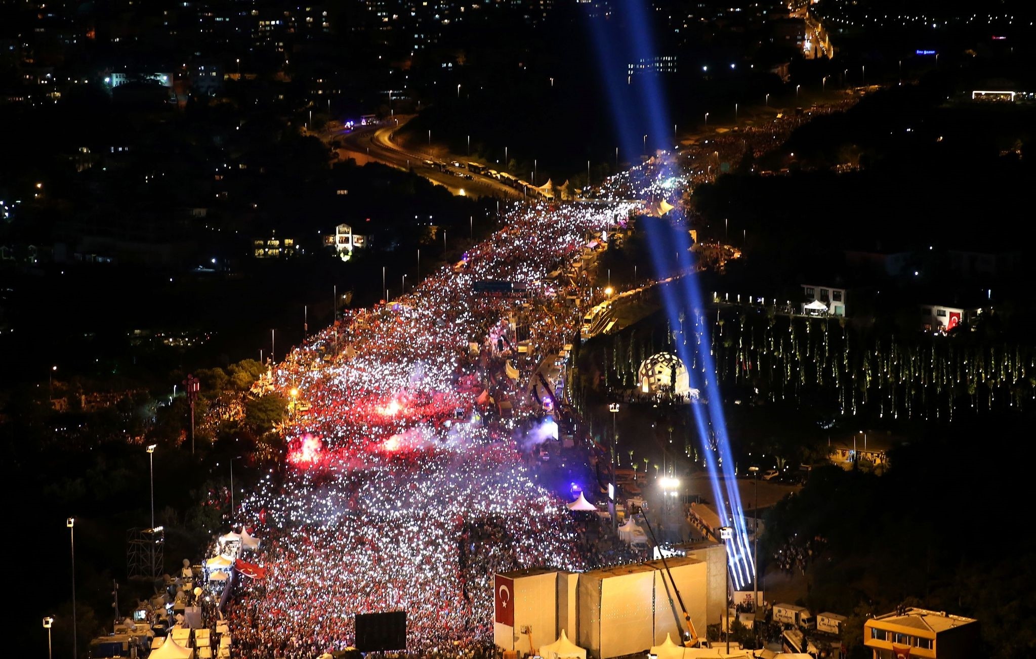 Millions of people wave national flags at the foot of the 'July 15 Martyrs Bridge' to commemorate the first anniversary of the failed coup in Istanbul, July 15.