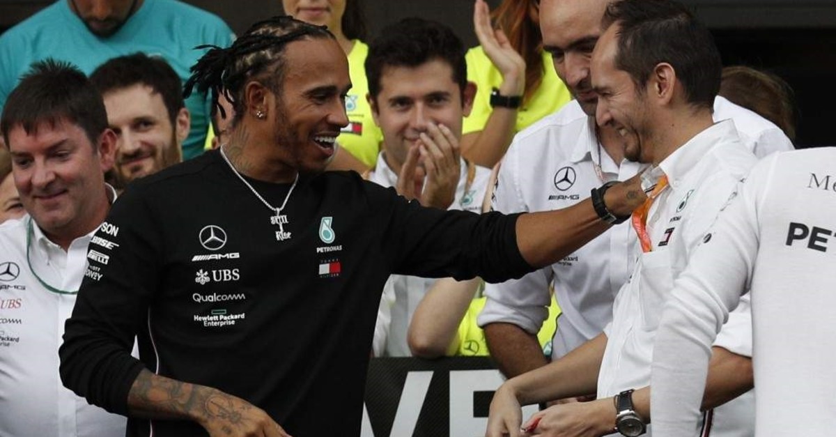 Lewis Hamilton (L) celebrates with Mercedes engineer Marcelo Martinelli following the Formula One Mexico Grand Prix, Mexico City, Oct. 27, 2019. (AP Photo)