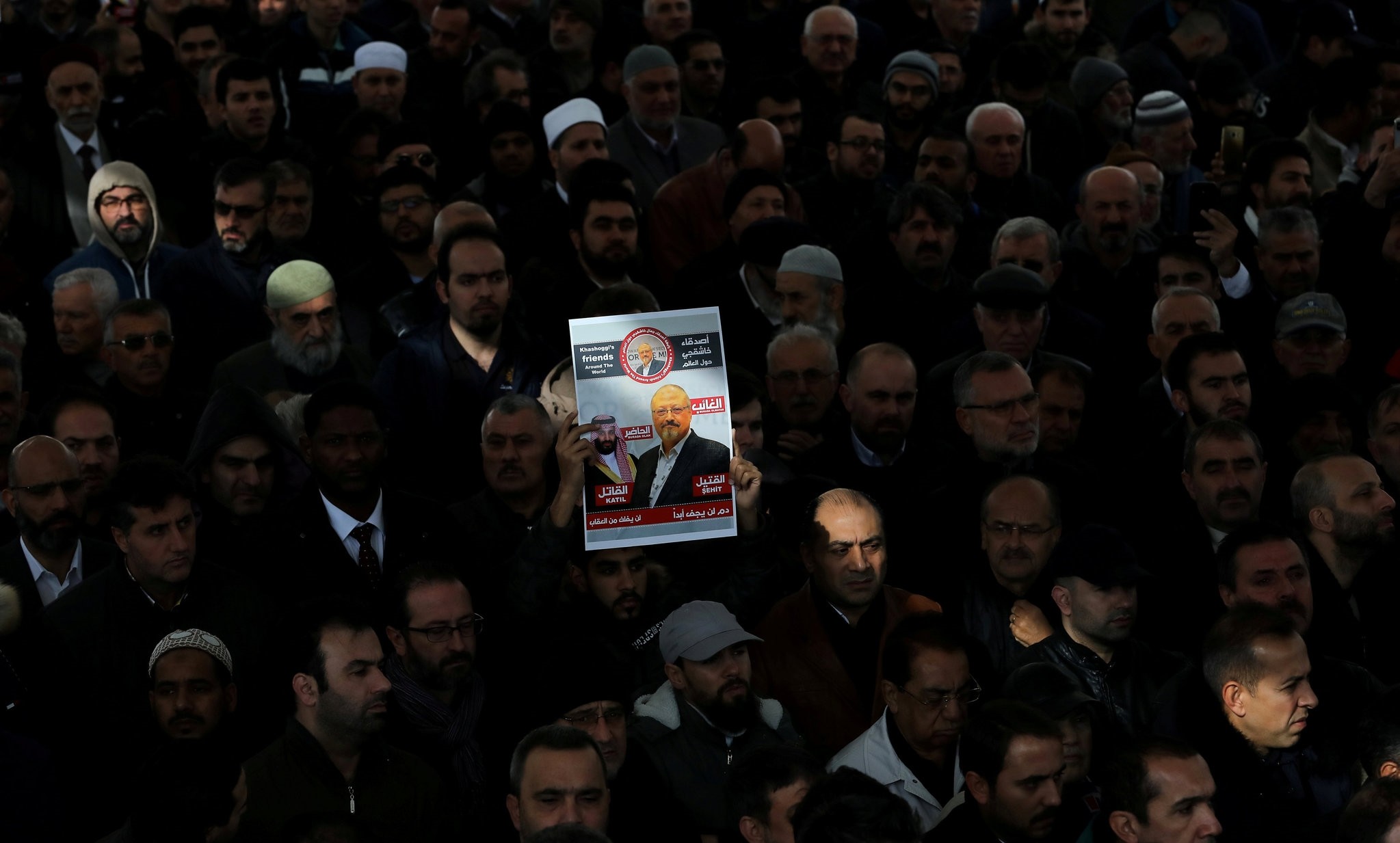 People attend a symbolic funeral prayer for Saudi journalist Jamal Khashoggi in the courtyard of Fatih Mosque in Istanbul, Nov. 16.