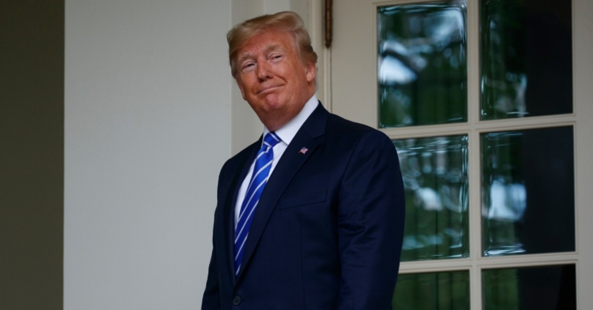 President Donald Trump walks into the Oval Office of the White House for a meeting with Mongolian President Khaltmaa Battulga, Wednesday, July 31, 2019, in Washington. (AP Photo)