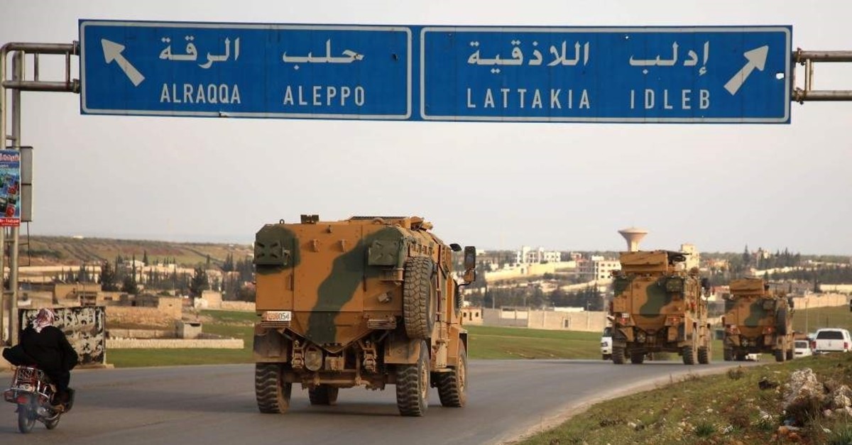 Turkish military vehicles drive in a convoy headed for the south of Idlib province as they pass by the town of Atareb in the western countryside of Aleppo on Feb. 3, 2020. (AFP Photo)