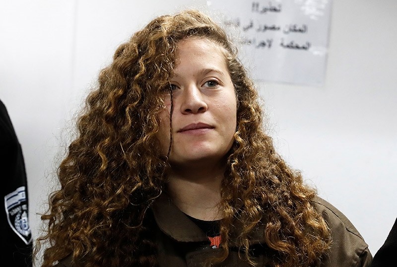 Sixteen-year-old Ahed Tamimi stands for a hearing in the military court at Ofer military prison in the West Bank village of Betunia, Jan. 1, 2018. (AFP Photo) 