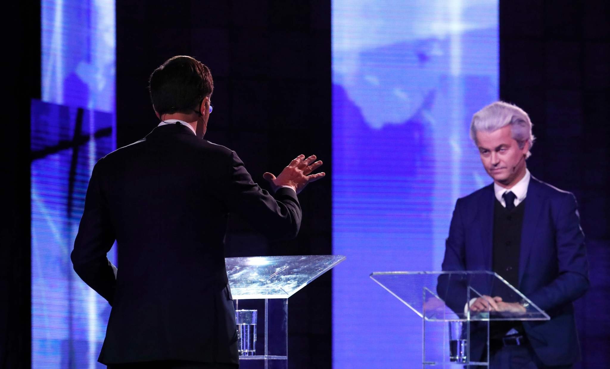 Dutch Prime Minister Mark Rutte (L) gestures while debating with the Netherlands' far-right politician Geert Wilders in Rotterdam on March 13, prior to the Dutch parliamentary elections held on March 15.