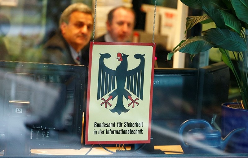 Security personnel sits behind the bullet-proof window at the headquarters of Germany's BSI national cyber defense body in Bonn, Germany, Jan. 4, 2019. (Reuters Photo)