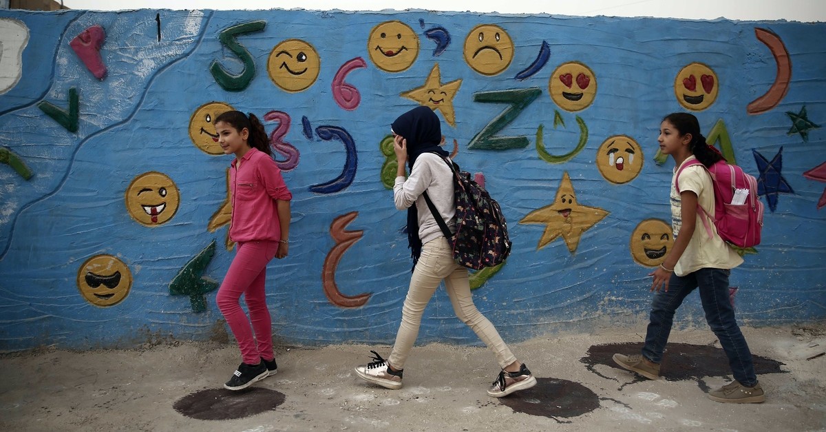 Syrian children walk to school in the northern city of Azaz, near the border with Turkey, Oct. 16, 2018.