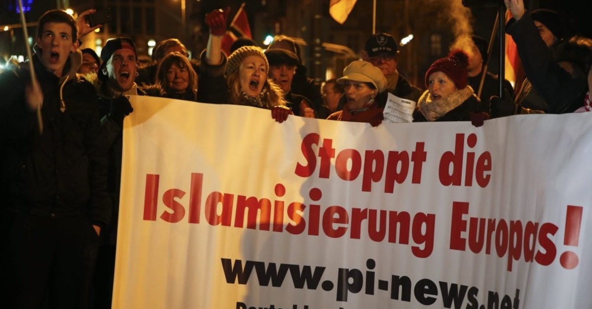 People take part in a march organized by an anti-Muslim movement in Cologne, Jan. 5, 2015.