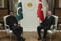 President Recep Tayyip Erdou011fan (R) and Pakistan's Prime Minister Imran Khan pose for the media before a one-to-one meeting in Ankara, Jan. 4.