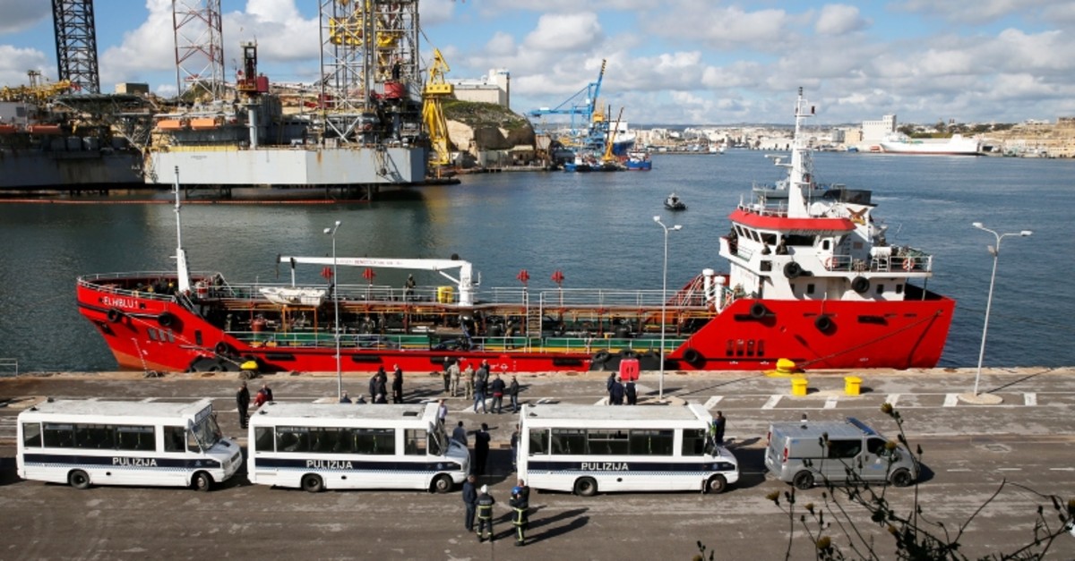 Police buses await migrants who arrived on merchant ship El Hiblu 1, in Senglea, in Valletta's Grand Harbour, Malta, March 28, 2019. (Reuters Photo)