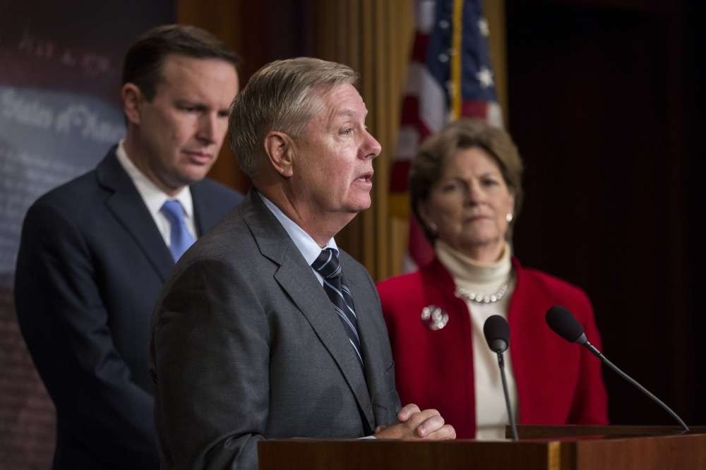 Sen. Lindsey Graham (C) speaks during a news conference about a resolution to end U.S. military support for Saudi Arabia's war with Yemen, Dec. 12, Washington.
