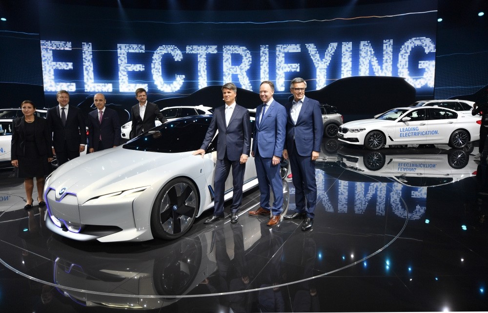 The BMW board pose for a photo at a BMW event during the first media day of the International Frankfurt Motor Show IAA in Frankfurt, which runs through Sept. 24, 2017.