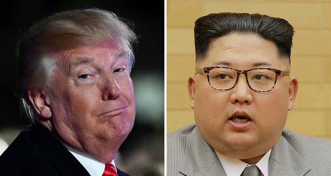 Trump (L) and North Korean Supreme Leader Kim Jong Un