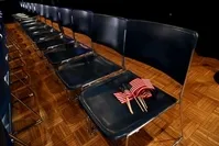 Flags are left on a seat before a rally by former Vice President Joe Biden in Des Moines, Iowa, U.S., Feb. 3, 2020. (Reuters Photo)