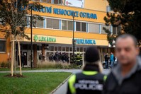 Police officers stand guard near the site of a shooting in front of a hospital in Ostrava, Czechia, Dec. 10, 2019. (Reuters Photo)