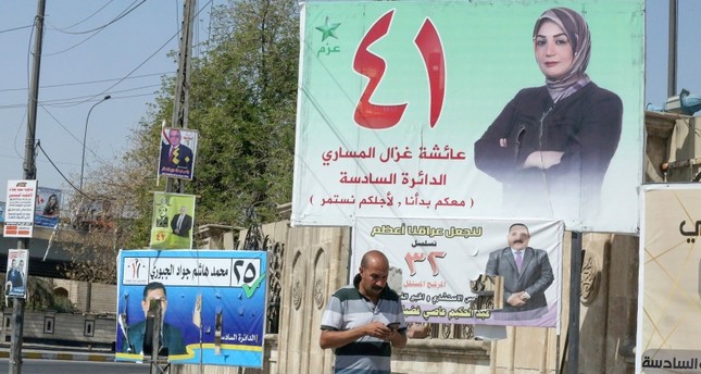 ملصق انتخابي في شوارع بغداد الفرنسية