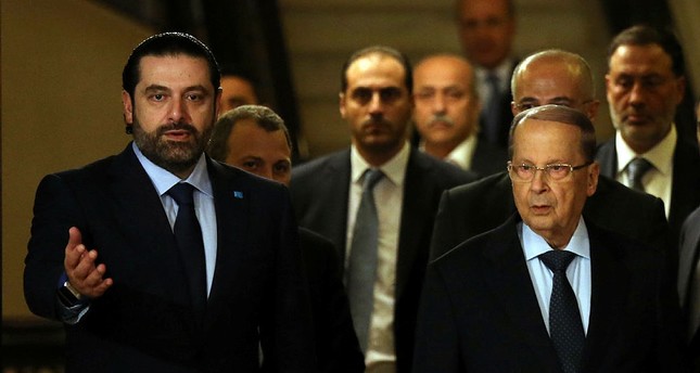 Former Lebanese Prime Minister Saad Hariri, left, welcomes Christian leader Michel Aoun, right, after he announced his support for Aoun to be the Lebanese president, in Beirut, Lebanon.(AP Photo)