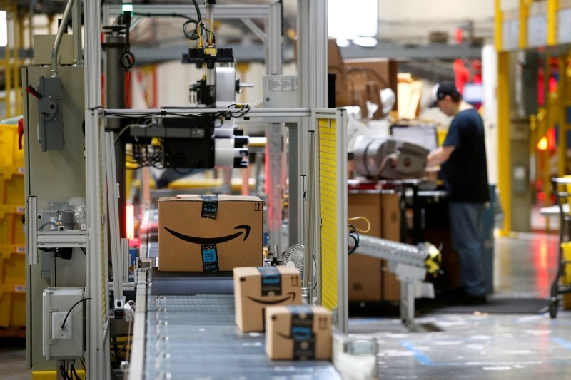 In this Aug. 3, 2017, file photo, packages pass through a scanner at an Amazon fulfillment center in Baltimore. (AP Photo)