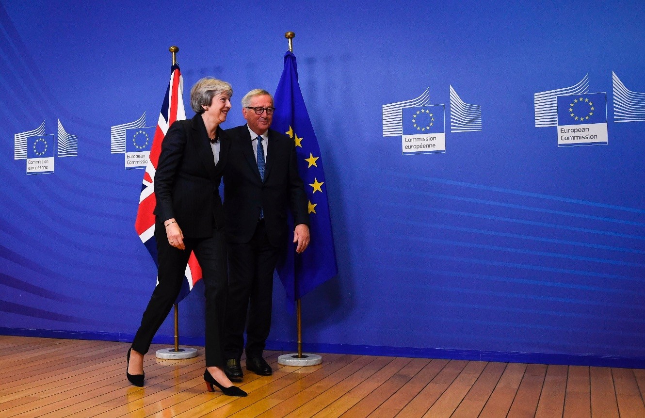 EU Commission President Jean-Claude Juncker and British Prime Minister Theresa May leave after a press briefing during a meeting at the EU Headquarters in Brussels, Nov. 21. 