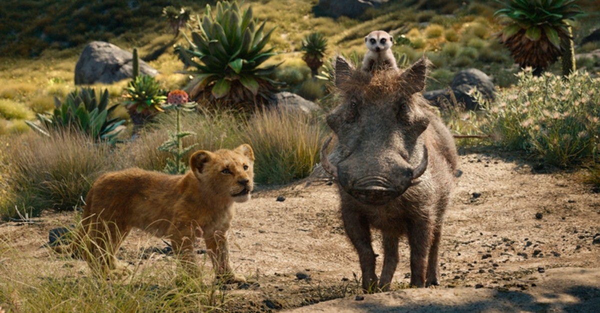 This file image released by Disney shows, from left, young Simba, voiced by JD McCrary, Timon, voiced by Billy Eichner, and Pumbaa, voiced by Seth Rogen, in a scene from ,The Lion King., (AP Photo)