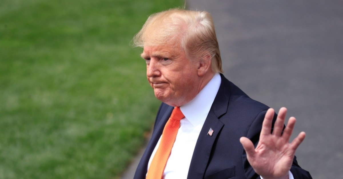 President Donald Trump waves after talking to reporters as he leaves the White House in Washington, Wednesday, April 24, 2019. (AP Photo)