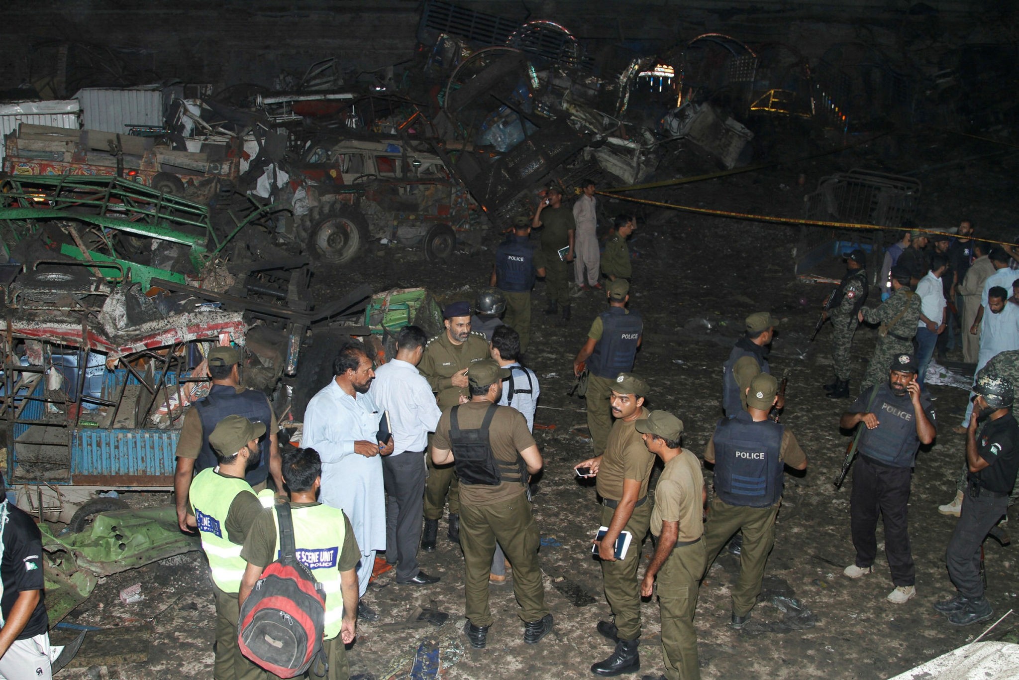 Pakistani security personnel visit the site of a blast in Lahore, Pakistan, Monday, Aug. 7, 2017. (AP Photo)