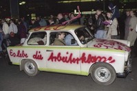 In this Nov. 11, 1989, file photo a Trabant car, made in East Germany, with a graffiti slogan 'Es lebe die Arbeiterklasse' (Shall the laboring classes live on) is pictured driving in West Berlin (AP File Photo)