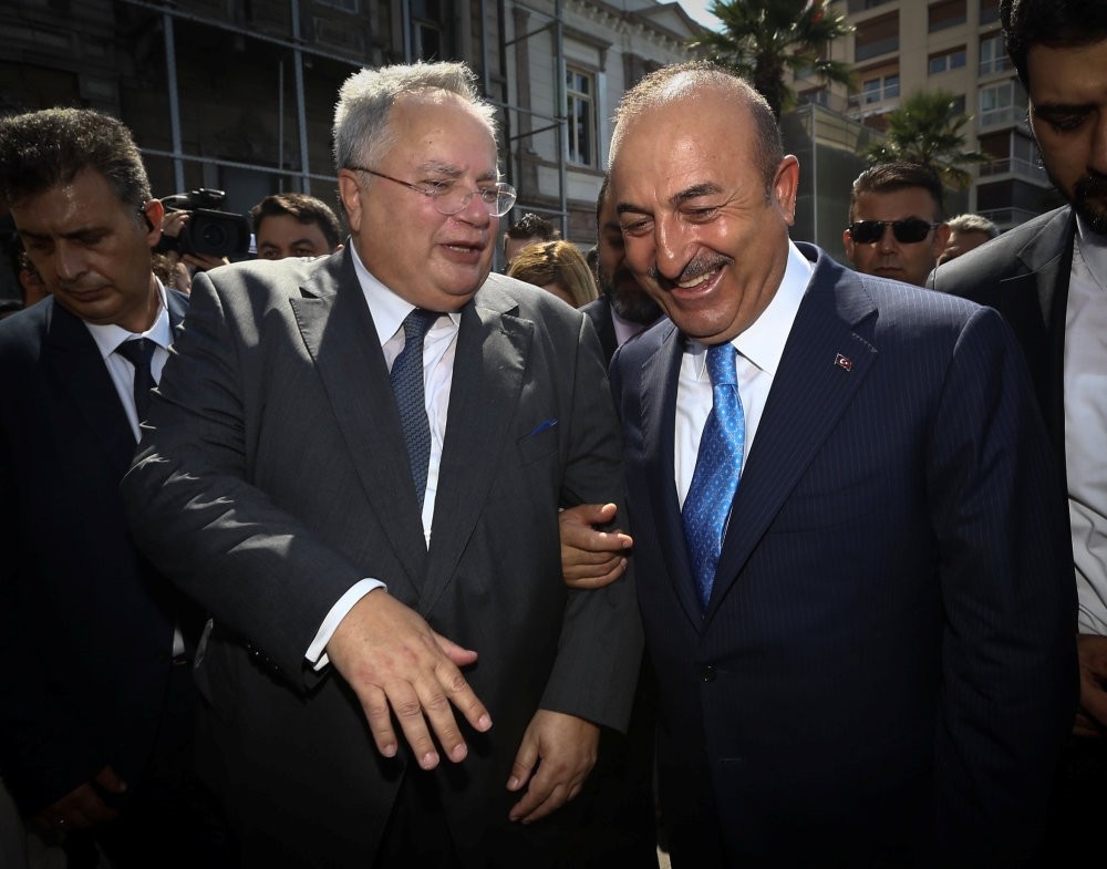 Foreign Minister Mevlu00fct u00c7avuu015fou011flu  and his Greek counterpart Nikos Kotzias (L) attend the inauguration of the renovated Greek Consulate building in u0130zmir, Sept. 4.
