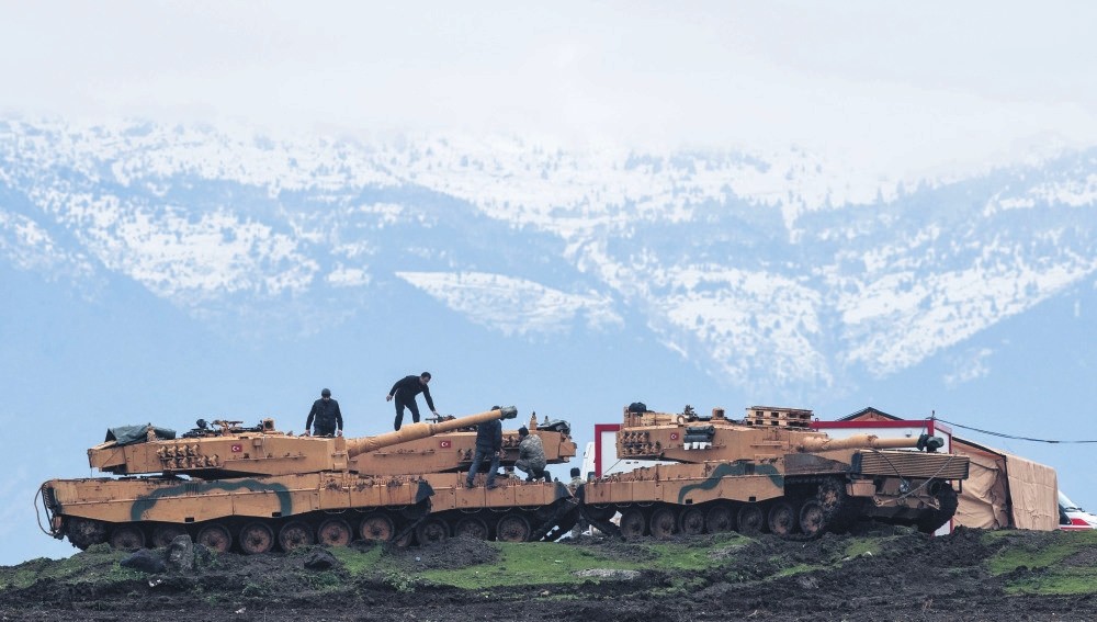 Turkish soldiers train with tanks and armored vehicles near the border with Syria, Hatay, Jan. 24. 