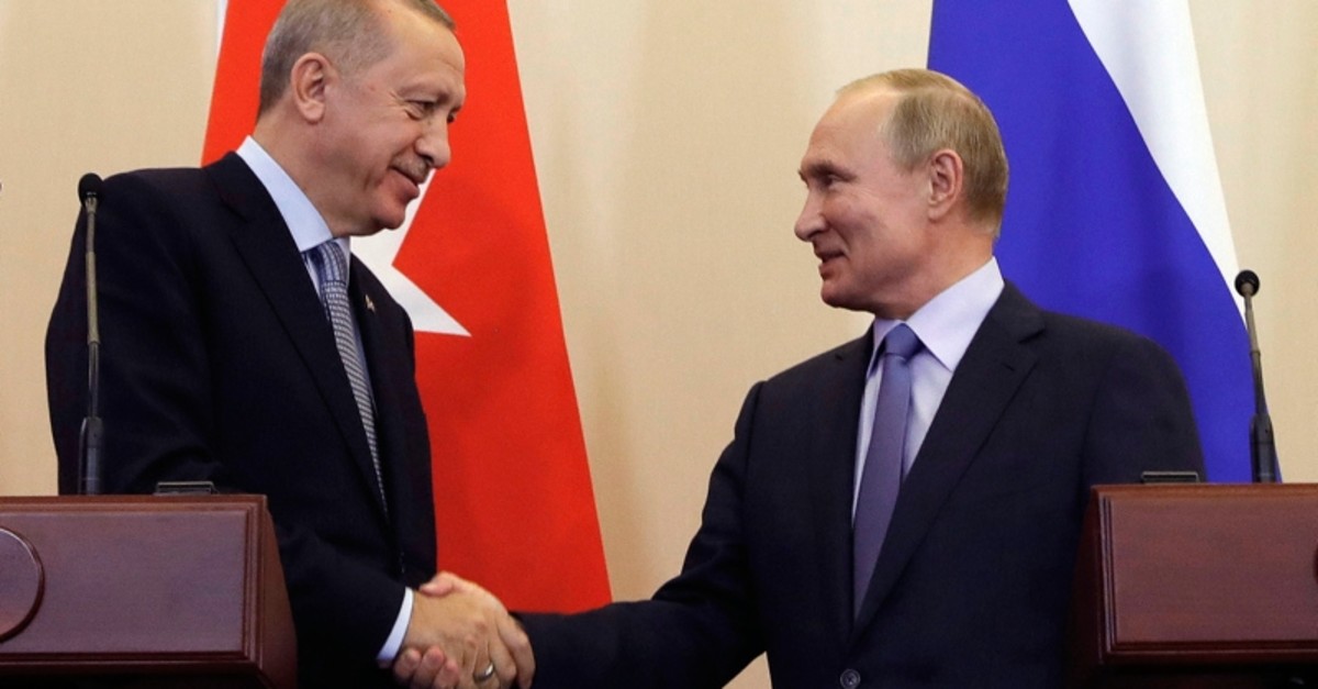 In this photo taken Tuesday, Oct. 22, 2019, Russian President Vladimir Putin, right, and President Recep Tayyip Erdou011fan shake hands after a joint news conference in Sochi, Russia. (Pool via AP)