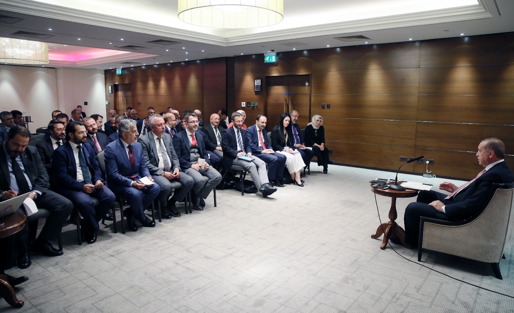 President Recep Tayyip Erdou011fan speaks to members of the Turkish press in London late on Tuesday.