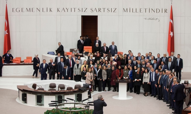 Deputies from the ruling AK Party pose for a souvenir photo marking the end of 2019 budget talks at the general assembly hall of Turkey's Parliament, in Ankara, on Dec. 22, 2018. (AA Photo)