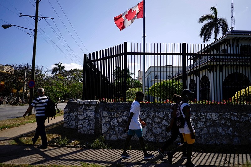 People pass by the Canada's Embassy in Havana, Cuba (Reuters Photo)