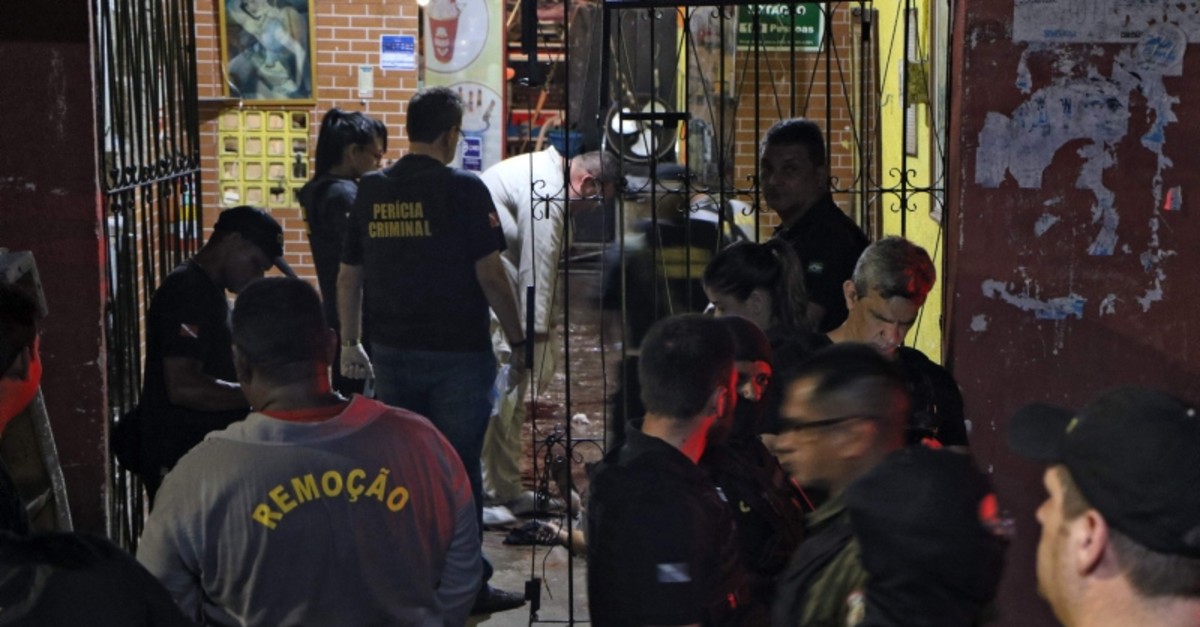 orensic personnel and criminal police remove corpses from a bar in Belem, Para state, Brazil on May 19, 2019 (AFP Photo)