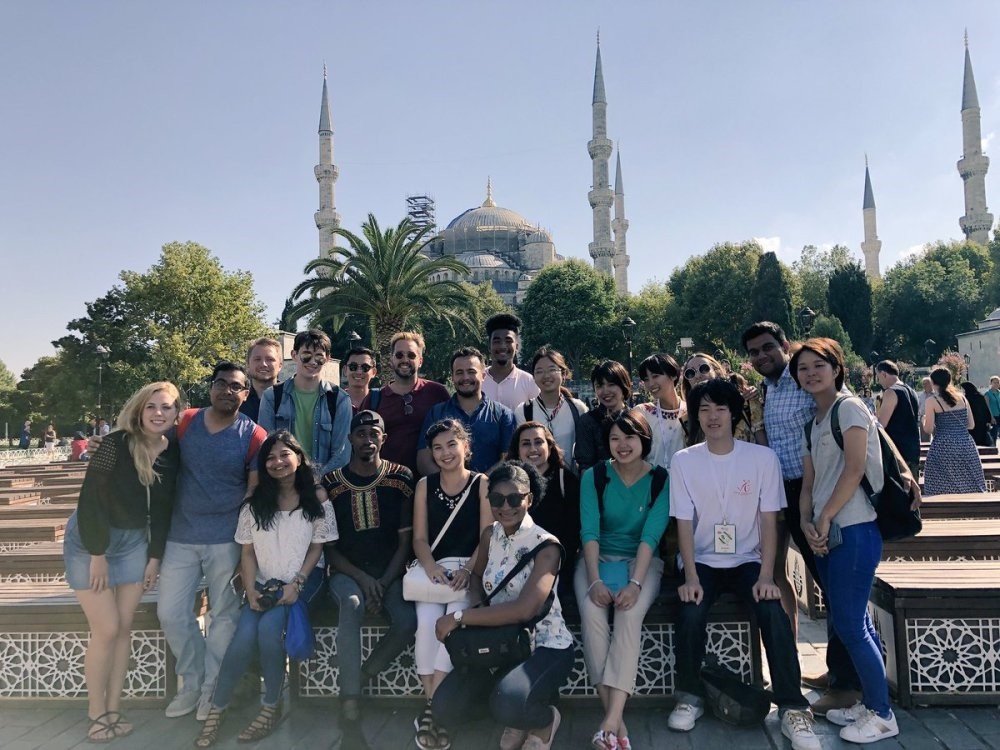 Students attending the Yunus Emre Institute's language course in Sultanahmet Square, Istanbul, during a field trip.