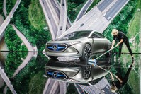 An employee cleans around electric concept car EQ A in Mercedes booth at the Internationale Automobil Ausstellung (IAA) auto show in Frankfurt am Main.