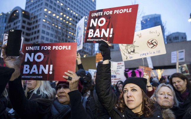 Protesters holding up signs in a demonstration against U.S. President Donald Trump’s executive order banning Muslims from certain countries, Seattle, Jan. 29.