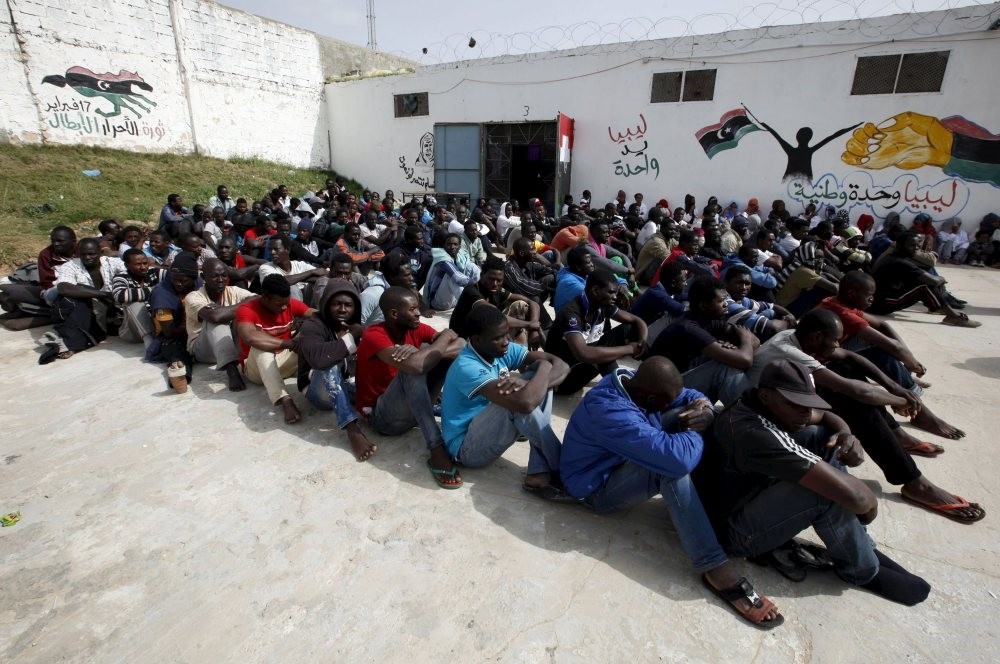 Illegal immigrants from sub-Saharan Africa sit in the Abu Saleem detention center in Tripoli, April 21, 2015.