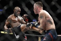 Usman lands a well-timed front kick against Covington in their mixed martial arts welterweight championship bout at UFC 245 in Las Vegas, Dec. 14, 2019. (AP Photo)