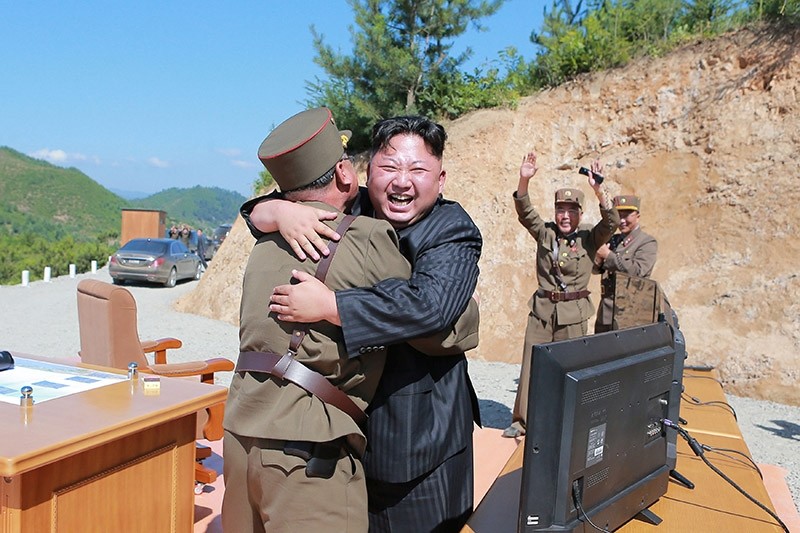 North Korean leader Kim Jong Un reacts with scientists and technicians of the DPRK Academy of Defense Science after the test-launch of the intercontinental ballistic missile Hwasong-14 in Pyongyang July, 5, 2017. (Reuters Photo)