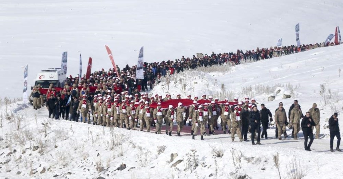 Some 20,000 people marched the route where soldiers perished 105 years ago in the march in Sar?kam??, Kars province, Jan. 5, 2020. (AA Photo)
