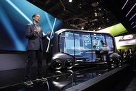 John Scumniotales of Amazon Alexa Automotive stands next to the Toyota e-Pallet concept while speaking at a news conference at CES International in Las Vegas.