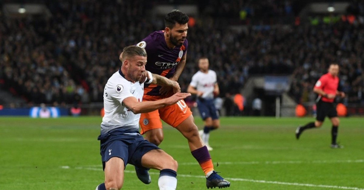 Toby Alderweireld of Tottenham and Sergio Aguero of Manchester City fight for the ball in a Premier League game, Oct. 29, 2018.