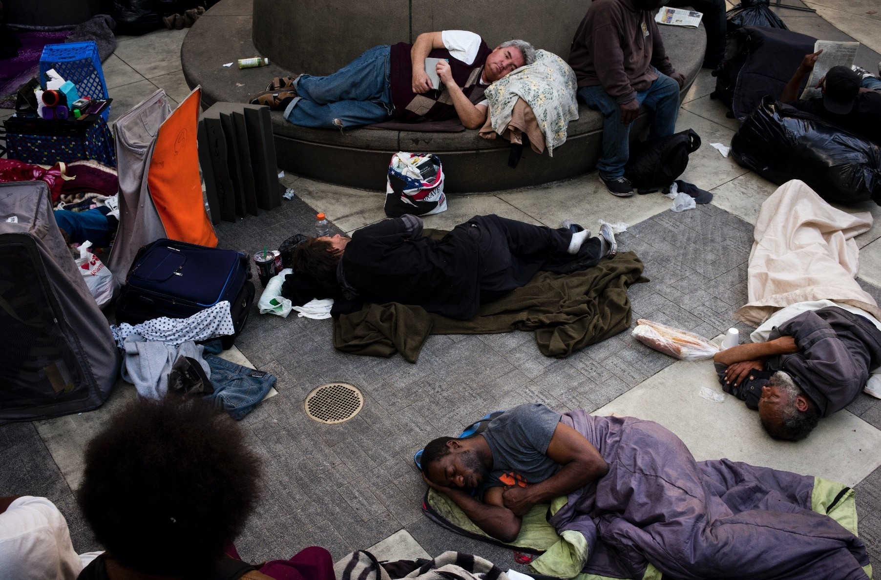 A group of homeless people sleep in the courtyard of the Midnight Mission in Los Angeles. The missionu2019s courtyard is open to all homeless people looking for a safe place to spend the night.
