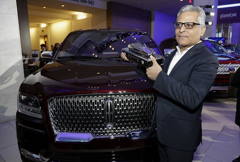 In this Jan. 15, 2018, file photo, Kumar Galhotra, group vice president for Lincoln stands next to the 2018 Lincoln Navigator at the North American International Auto Show in Detroit. (AP Photo)