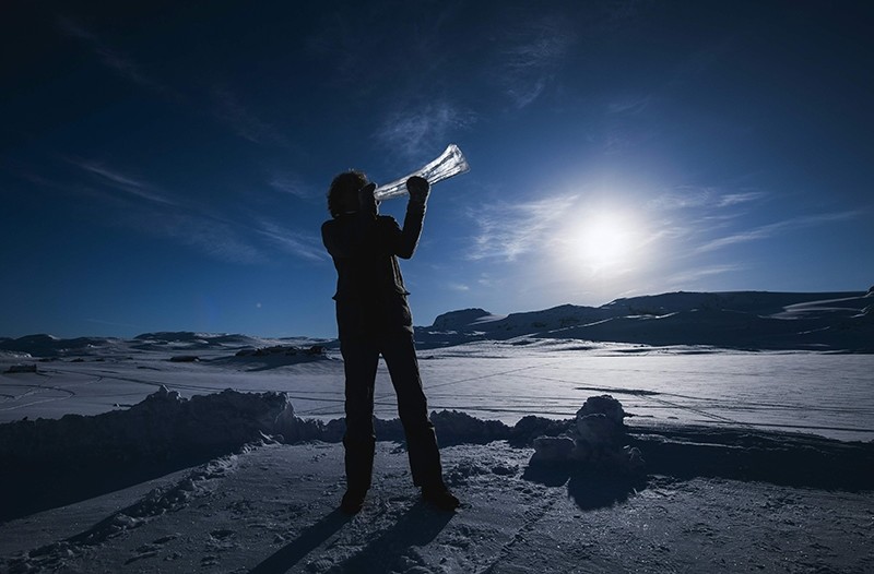 Terje Lsungset, the founder and artistic director of the Ice Music Festival, tests a musical instrument made of ice outside his workshop ahead of the festival on Feb. 2, 2018. (AFP Photo)