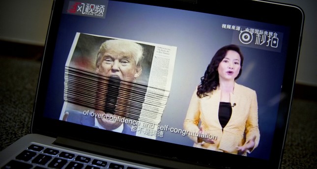 An online video about U.S.-China trade tensions produced by China's state television broadcaster plays on a computer screen in Beijing, China, Thursday, Aug. 23, 2018. (AP Photo)