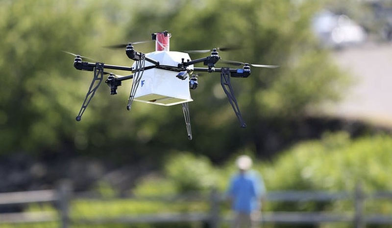 This file photo shows a drone aircraft with a payload of simulated blood, and other medical samples flies during a ship-to-shore delivery simulation Wednesday, June 22, 2016, in Lower Township, N.J. (AP Photo)