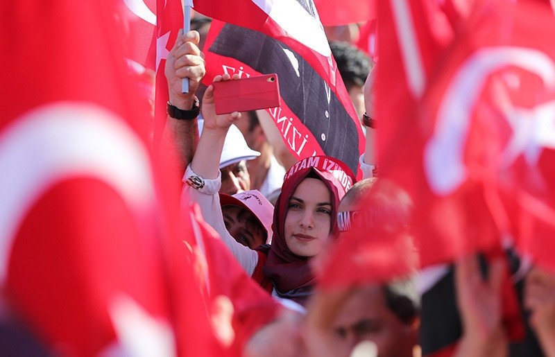 A young woman wearing a headscarf seen attending to the democracy rally organized by center-left CHP. The headband reads: “Forefather, we are on your path,” a slogan generally used by secular Turks referring to Atatürk. (EPA Photo)