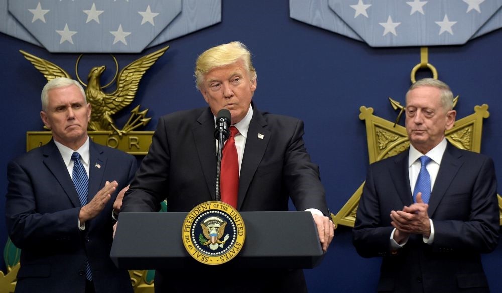 U.S. President Donald Trump flanked by Vice President Mike Pence (L) and Defense Secretary James Mattis (R) as he speaks during an event at the Pentagon in Washington.